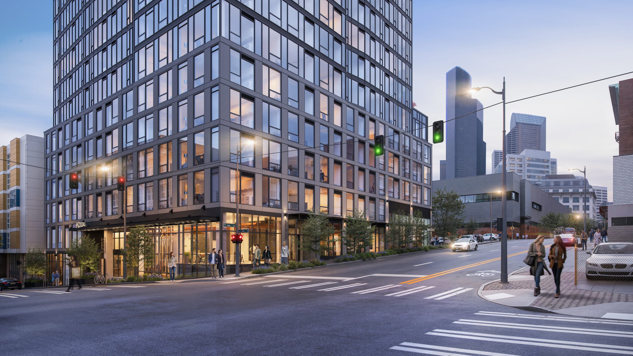 KODA Condos Seattle street-level exterior architectural rendering by Bogza.com. A twilight corner view of the 17-story residential tower at 5th Avenue and South Main Street, highlighting the warm, illuminated ground-floor retail spaces, large floor-to-ceiling windows, and active pedestrians.