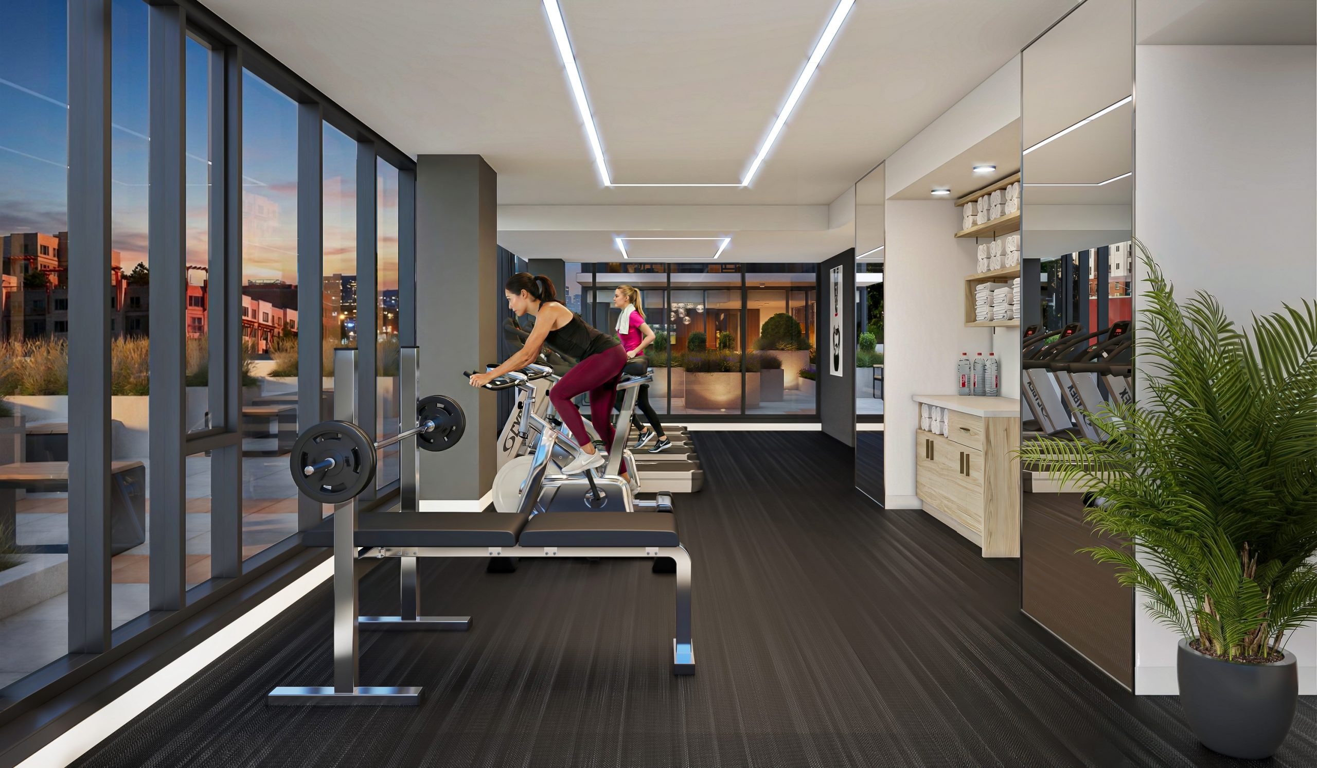 KODA Condominiums Seattle wellness center and gym interior rendering by Bogza.com. A modern, state-of-the-art 7th-floor fitness center featuring cardio exercise bikes, treadmills, a free-weight bench, and floor-to-ceiling windows revealing the landscaped outdoor terrace.