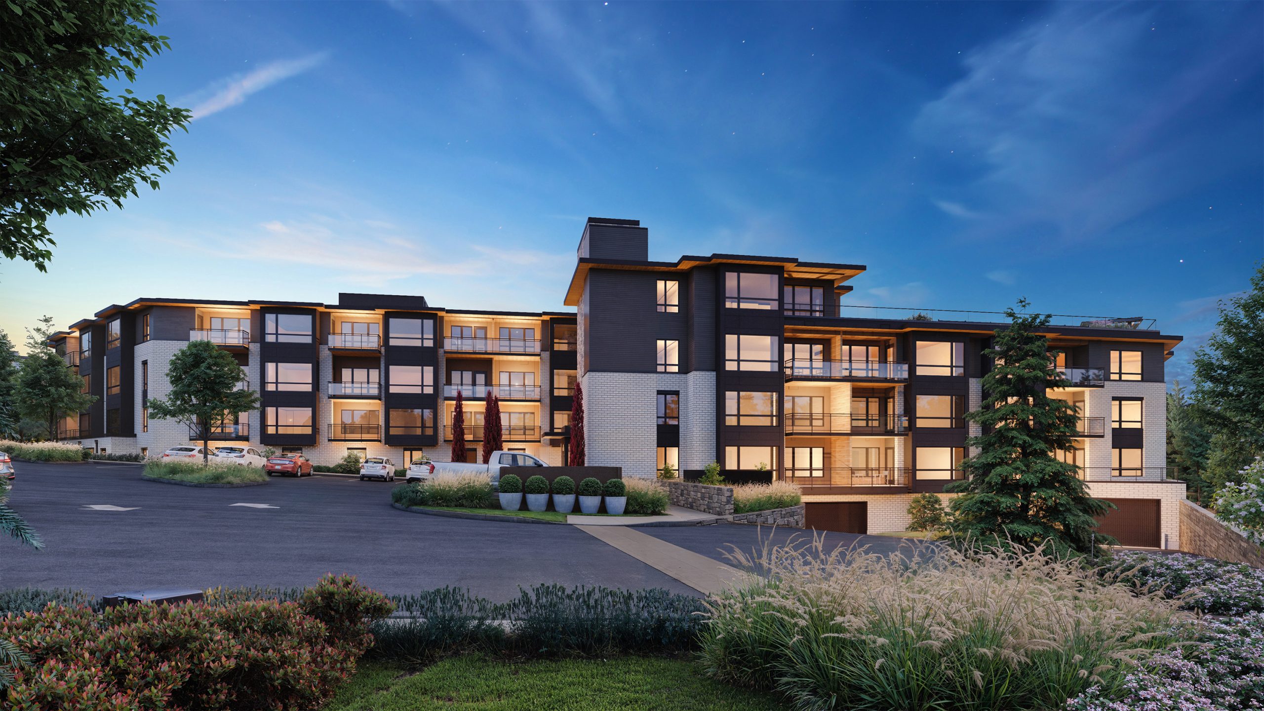The Springs at Lake Oswego modern exterior architectural rendering by Bogza.com. A twilight view of the assisted living and memory care community's multi-story facade, featuring a blend of light brick and dark panels, glowing residential balconies, and a landscaped driveway.