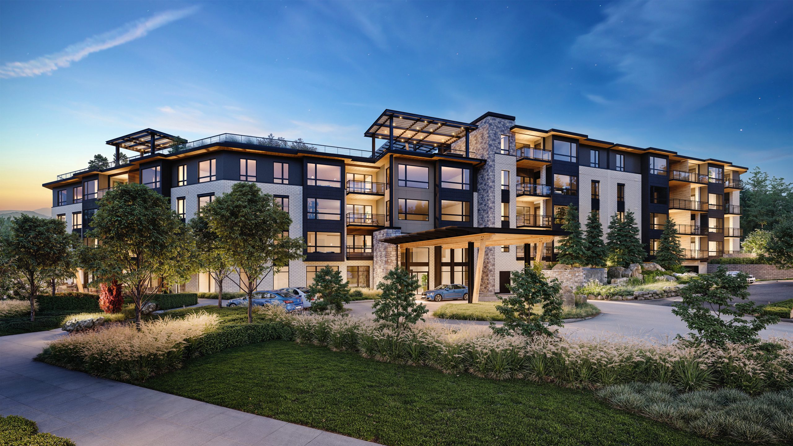 The Springs at Lake Oswego main entrance architectural rendering by Bogza.com. A welcoming twilight view of the luxury senior living facility, highlighting the grand timber-framed porte-cochere, elegant glass lobby doors, warm lighting, and lush entryway landscaping.