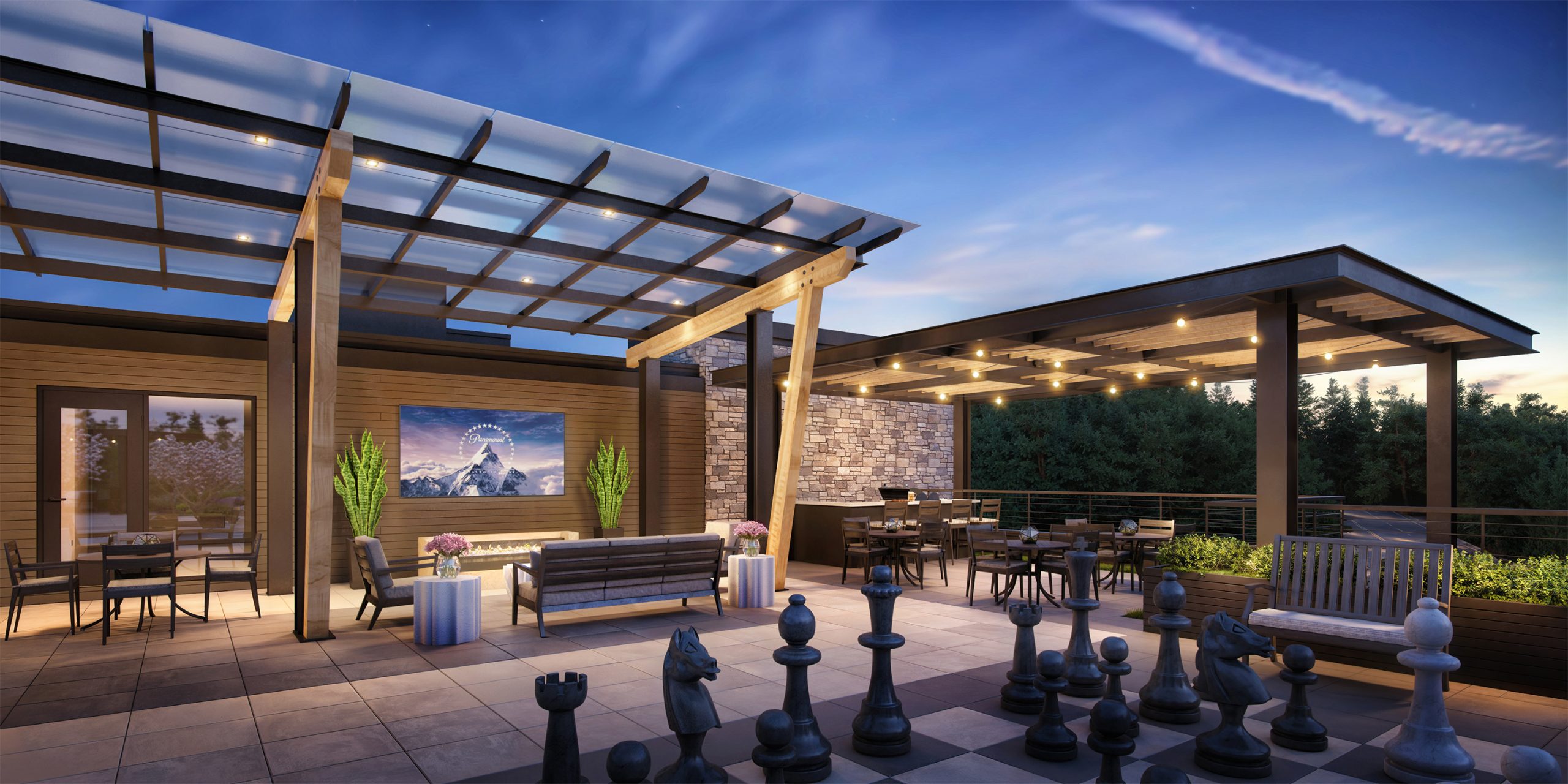 The Springs at Lake Oswego rooftop terrace amenity architectural rendering by Bogza.com. An expansive outdoor sky deck at twilight featuring a giant chessboard, a comfortable lounge area with an outdoor TV and modern fireplace under a glass pergola, and an adjacent covered dining space with sweeping valley views.