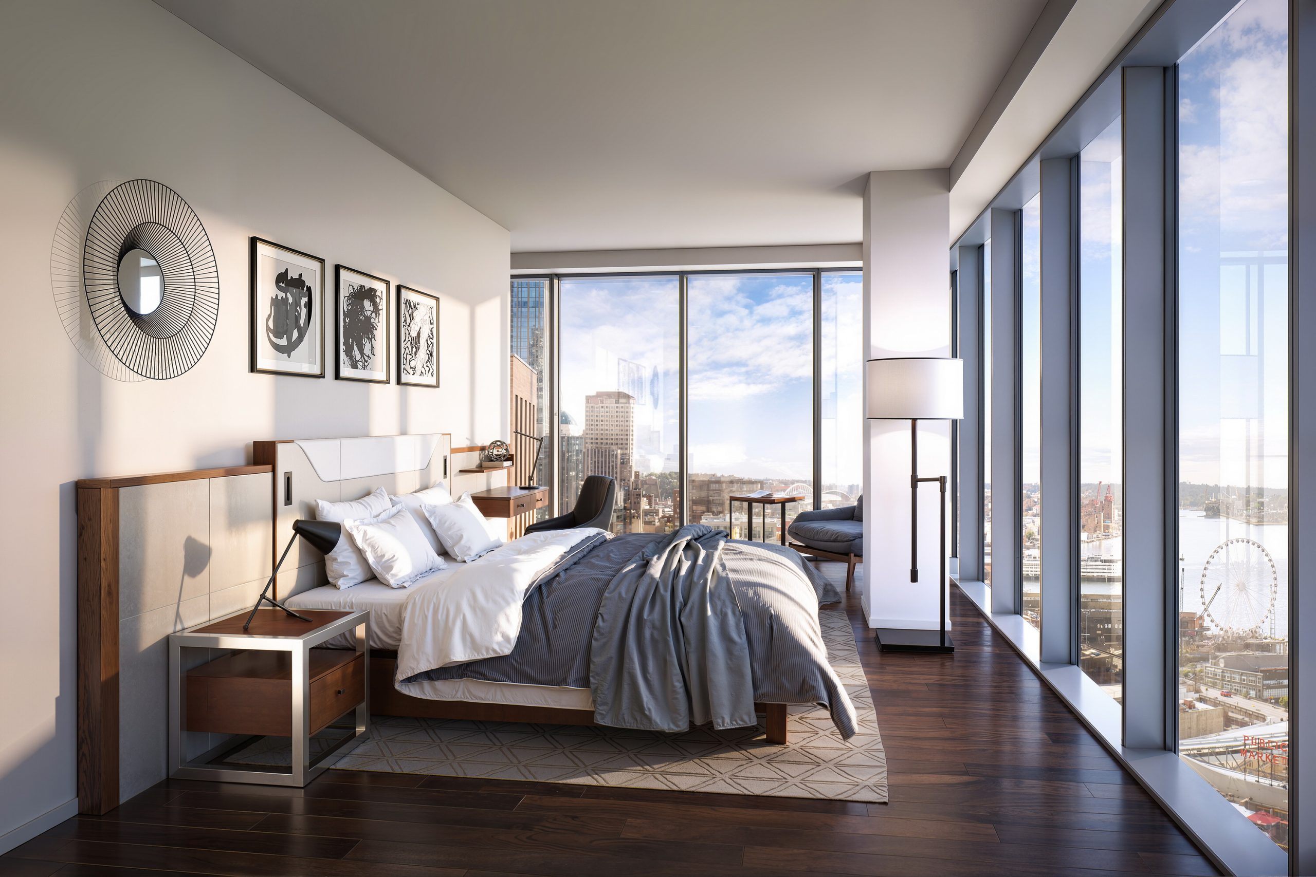 Thompson Seattle Hotel luxury guest room interior rendering by Bogza.com. A bright, contemporary bedroom suite featuring warm wood flooring, a comfortable bed with luxury linens, mid-century modern furnishings, and floor-to-ceiling windows framing expansive views of downtown Seattle and the waterfront.
