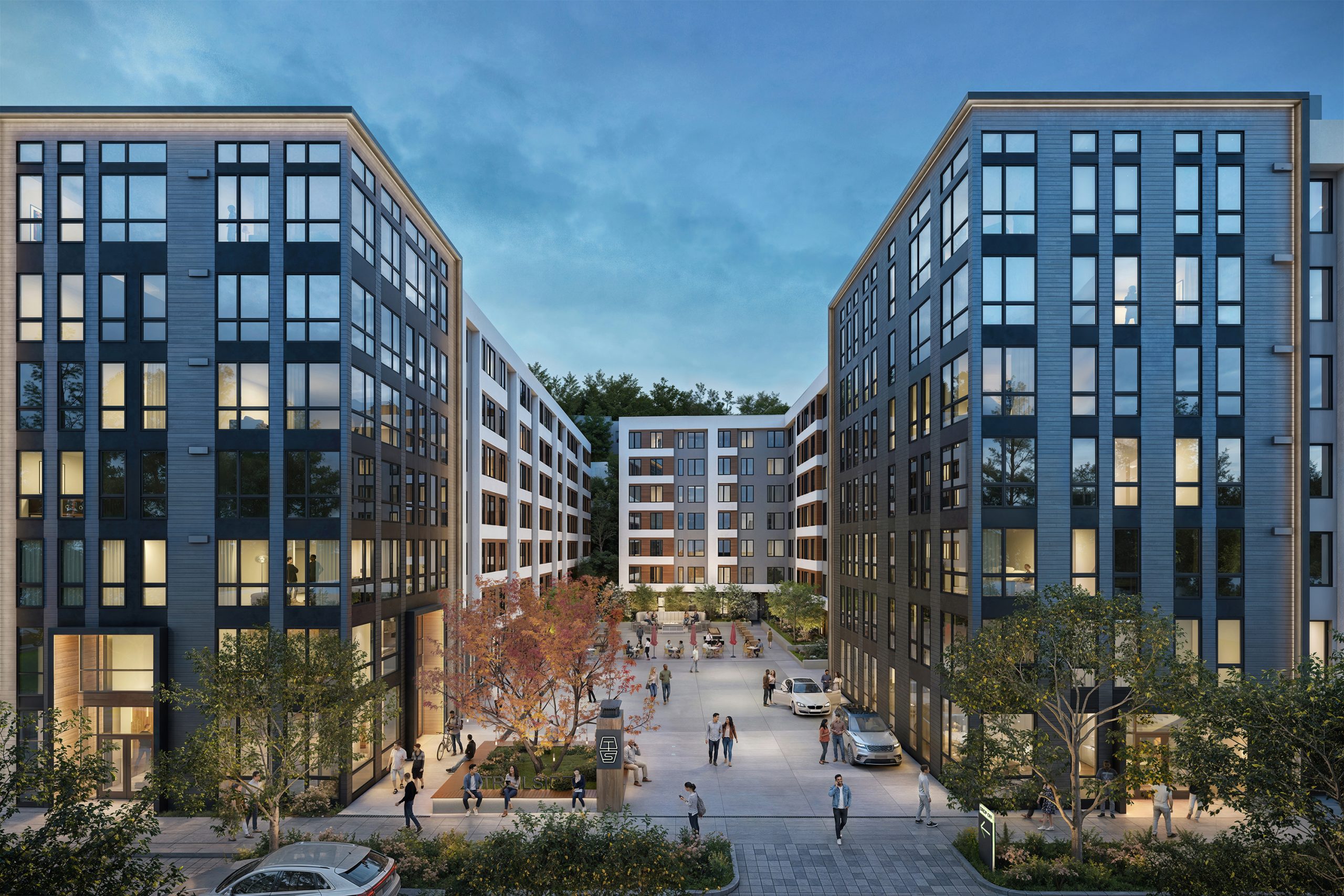 Trailside Student Living Seattle architectural exterior rendering by Bogza.com. A dusk view of the student housing development's main entrance, featuring a large paved public plaza, a modern dark paneled and white facade, glowing interior lights, and students gathering.