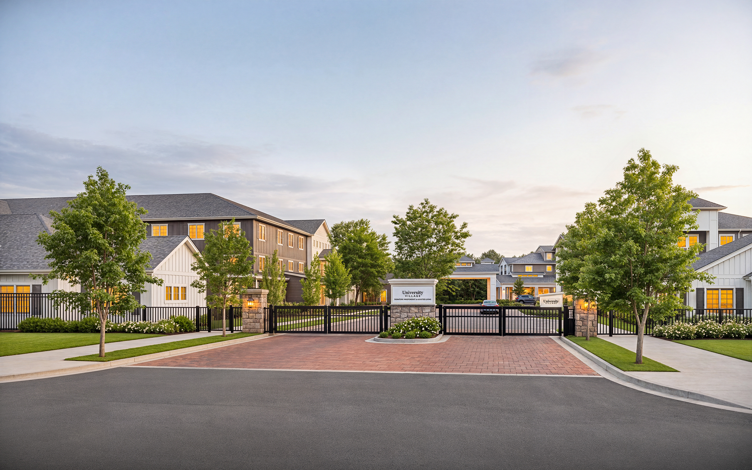 University Village senior living community entrance drive architectural rendering by Bogza.com. A sunset view looking toward the gated entry, showcasing the expansive retirement campus, beautiful tree-lined streets, and the prominent stone and white wood monument sign.