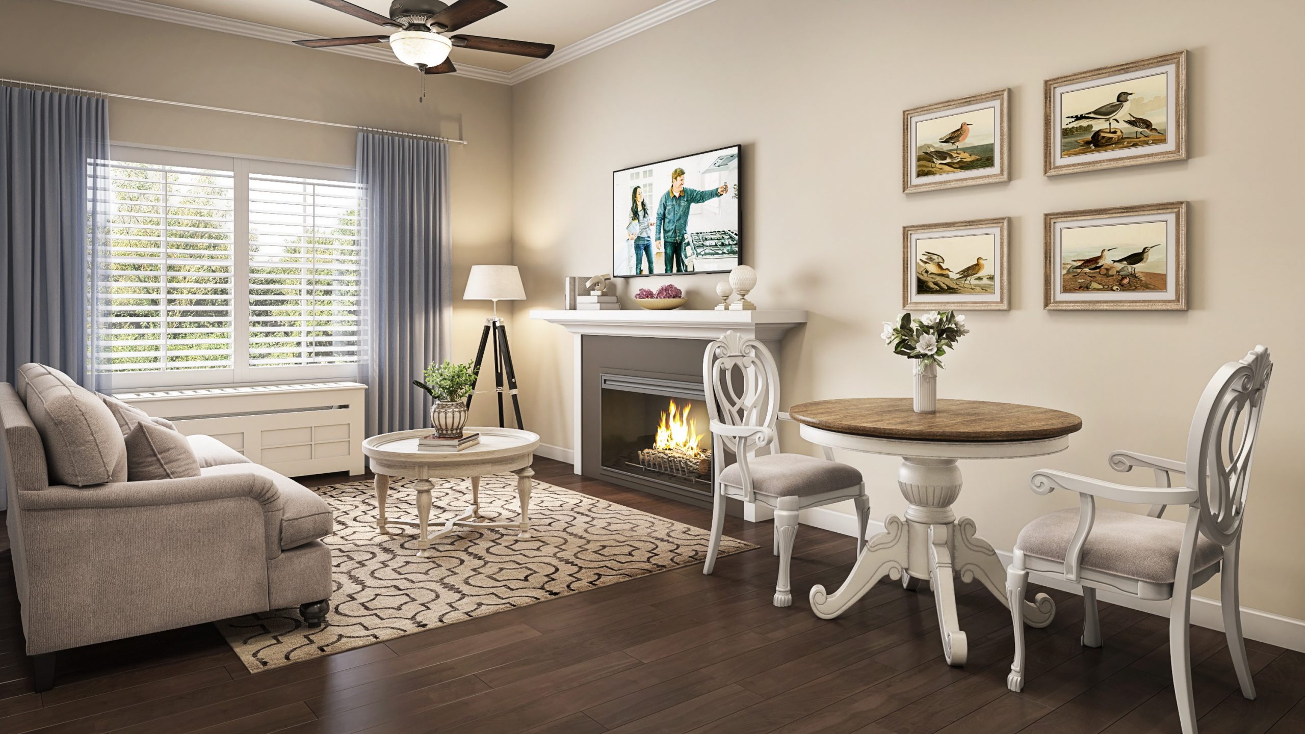 University Village senior living apartment living room interior rendering by Bogza.com. A cozy, traditional private suite featuring a comfortable sofa, a round dining table with classic chairs, a warm fireplace with a flat-screen TV, and wood-style flooring.