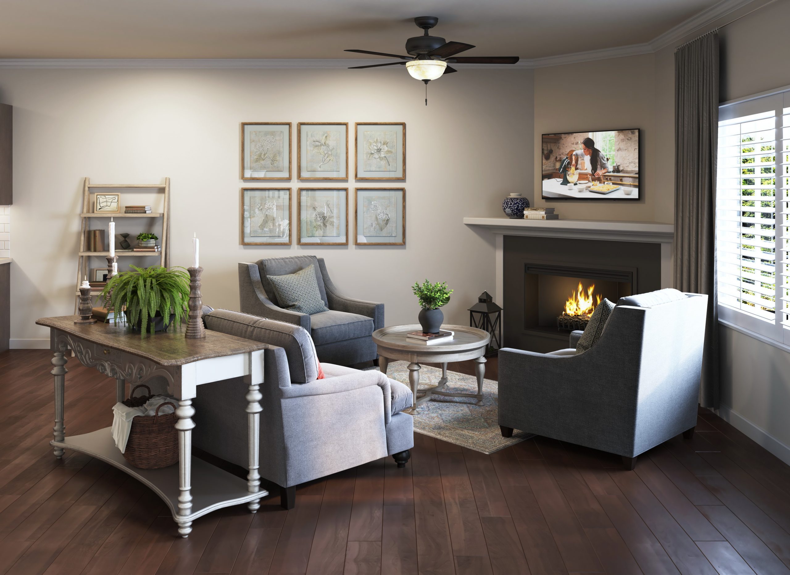 University Village senior living apartment lounge interior architectural rendering by Bogza.com. A comfortable, traditional living room featuring cozy armchairs around a coffee table, a warm fireplace with a flat-screen TV above, and wood-style flooring.