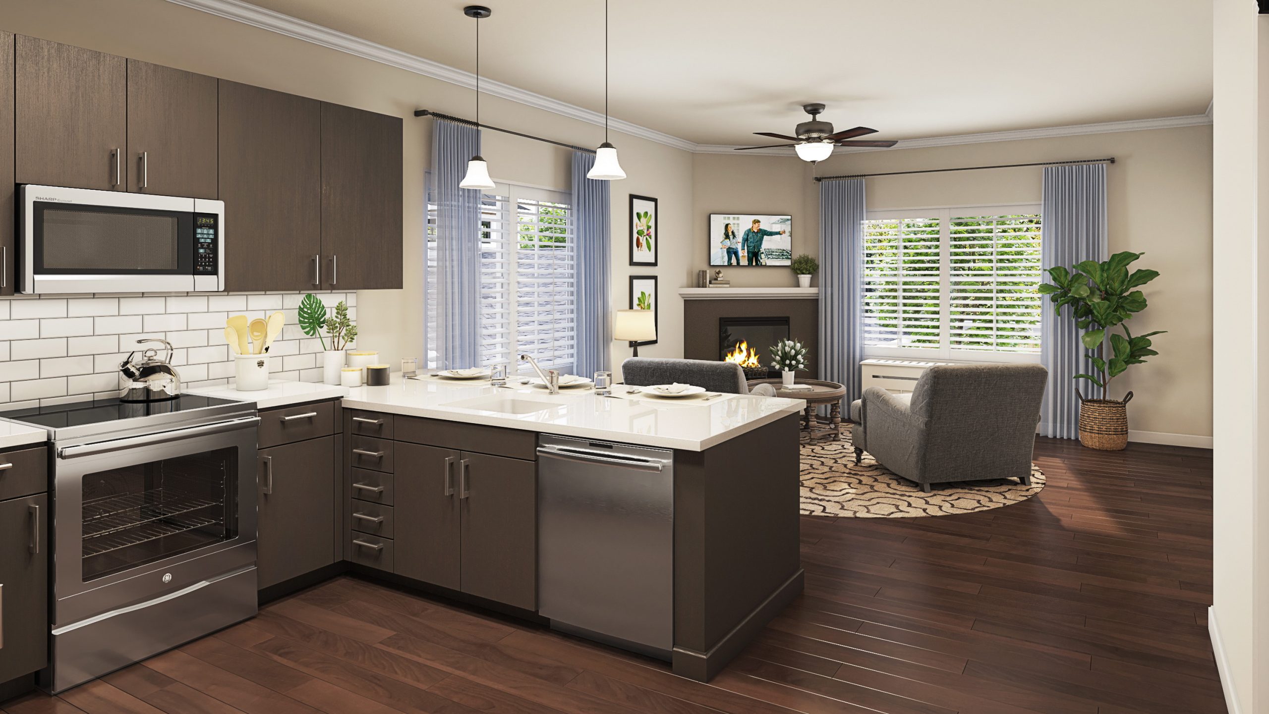 University Village senior living open-concept kitchen and living room rendering by Bogza.com. A bright, expansive private suite featuring a modern kitchen with dark cabinetry and stainless steel appliances, seamlessly flowing into a cozy lounge area with a fireplace.